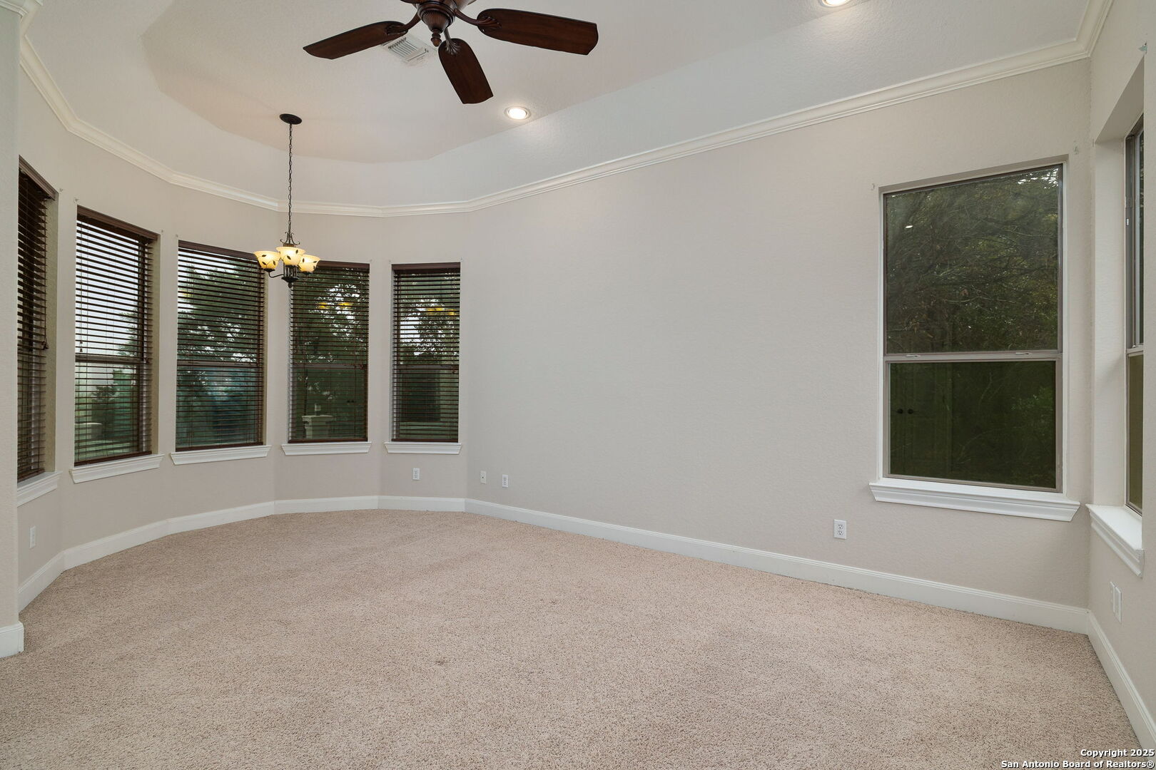 11235 Indian Caves Helotes, TX 78023 - Photo 21 of 45 a view of an empty room with a window and kitchen view