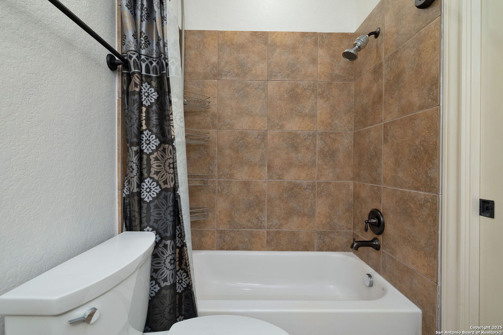 11235 Indian Caves Helotes, TX 78023 - Photo 35 of 45 a bathroom with a bathtub a toilet and a shower
