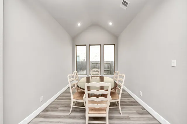 a kitchen with a table and chairs in it