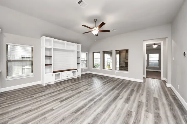 a view of kitchen with sink microwave and refrigerator