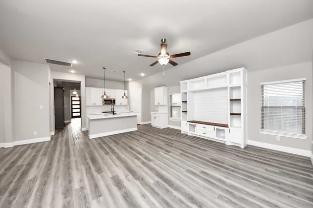 a view of kitchen with wooden floor and window