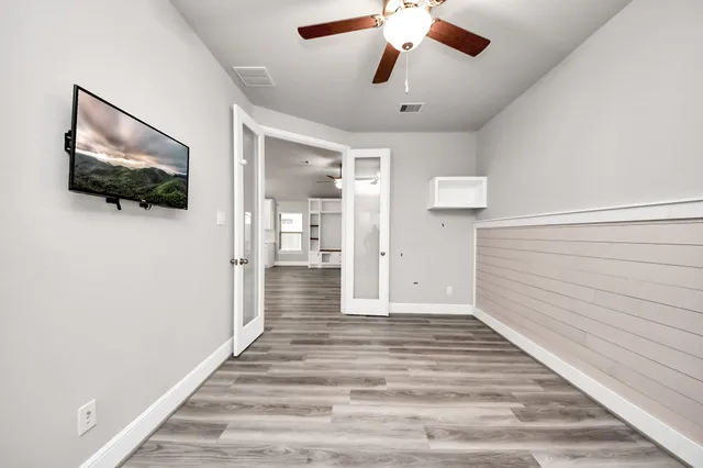 a view of an empty room with a window