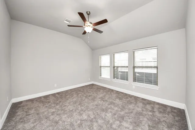 a spacious bathroom with a mirror sink and bathtub