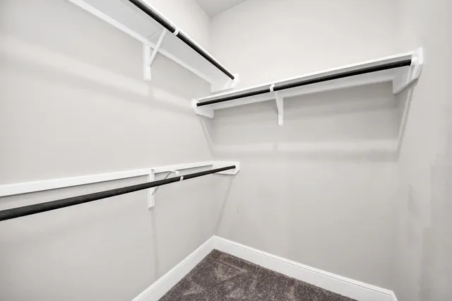 a bathroom with a granite countertop sink mirror and a bathtub