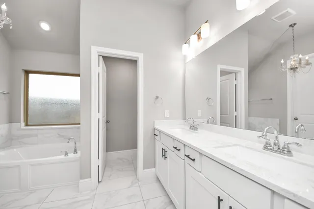 a bathroom with a bathtub and a shower