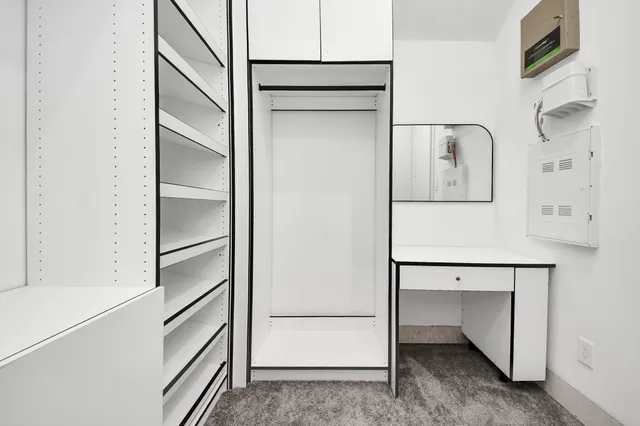 a view of a porch with furniture and floor to ceiling window