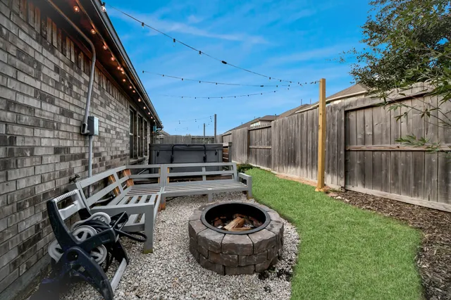 a view of balcony with wooden floor and fence