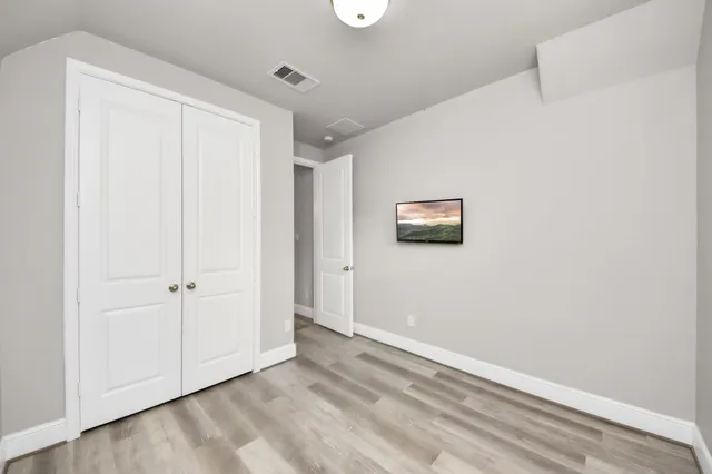 a bathroom with a sink a toilet and shower curtain