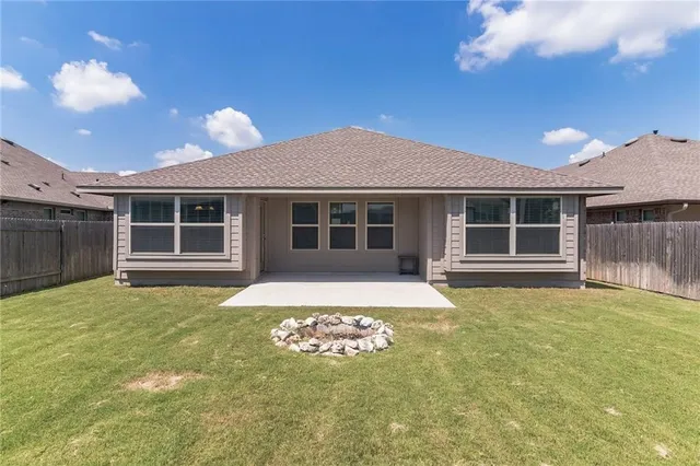 a house view with a sitting space and garden space