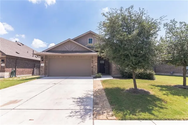 a view of a back yard of the house