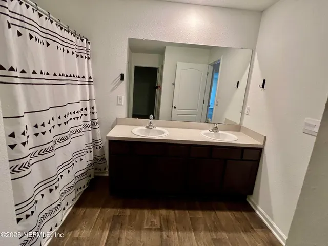 a bathroom with a sink and a mirror