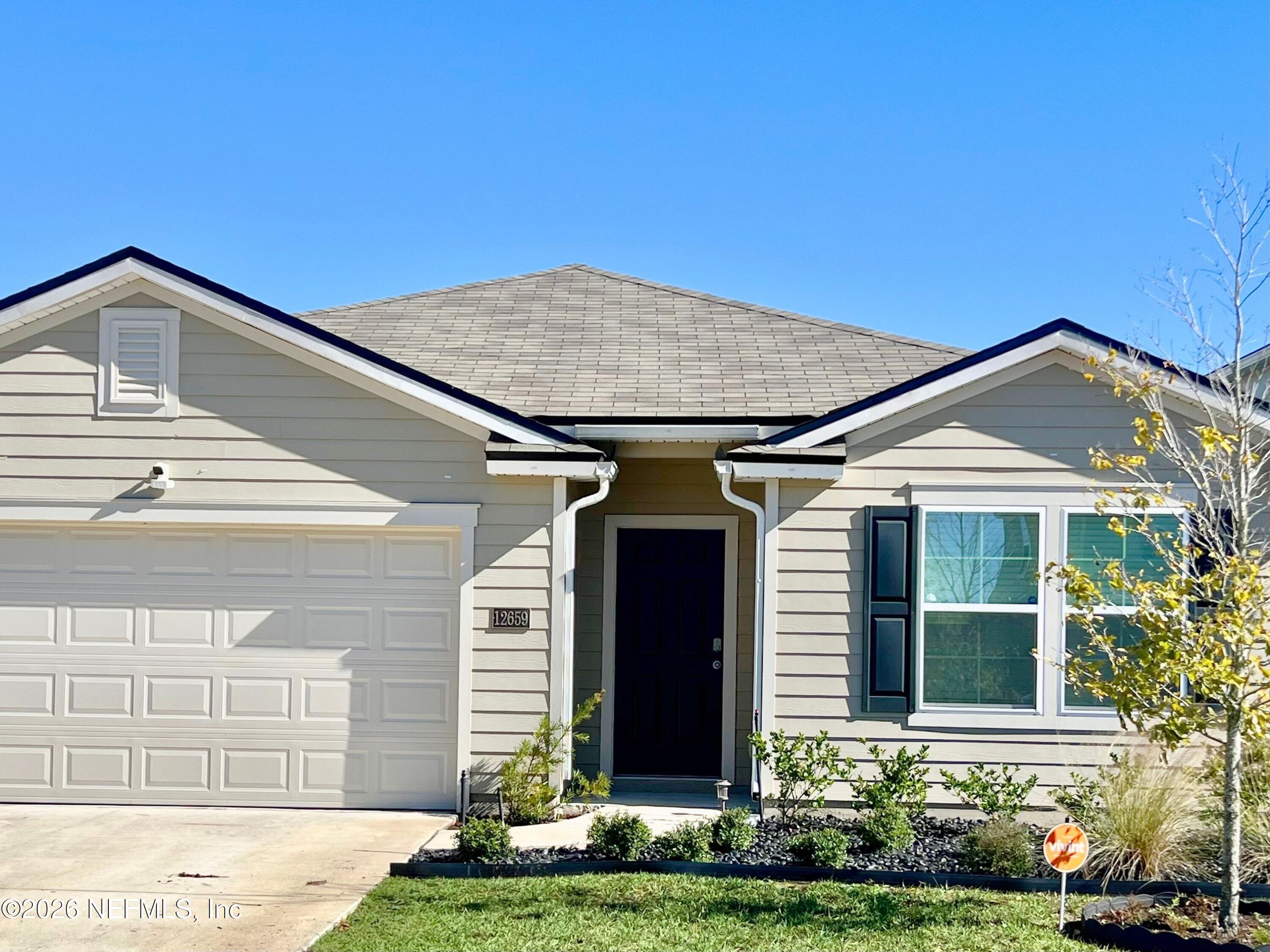 12659 European Beech Road Jacksonville, FL 32218 - Photo 2 of 30 a front view of a house with a yard