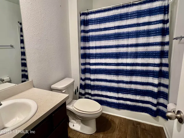 a bathroom with a toilet and a sink