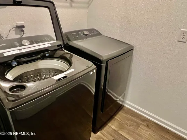 a utility room with dryer and washer