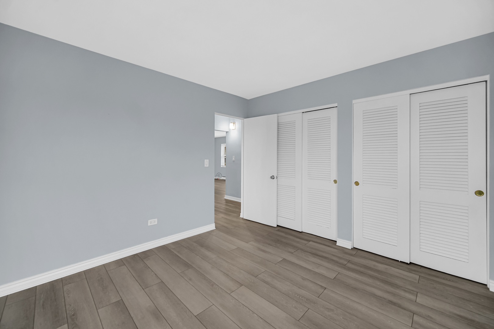 3725 North Harlem Avenue, Unit F Chicago, IL 60634 - Photo 11 of 15 a view of an empty room with wooden floor