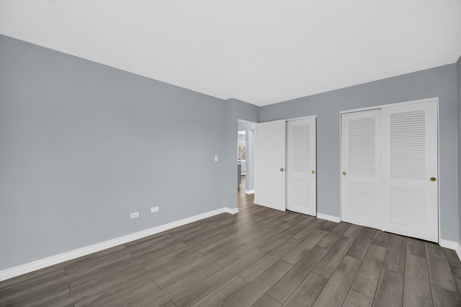 3725 North Harlem Avenue, Unit F Chicago, IL 60634 - Photo 8 of 15 a view of an empty room and wooden floor