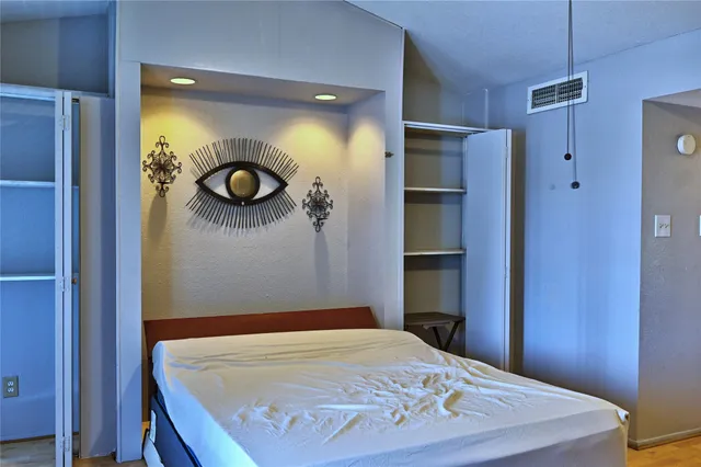 a view of a dining room with furniture and a window