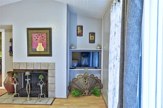 a kitchen with a table chairs and white cabinets