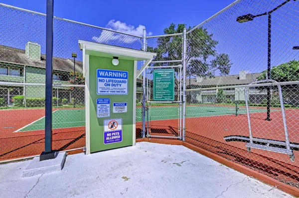 a swimming pool with outdoor seating yard and barbeque oven
