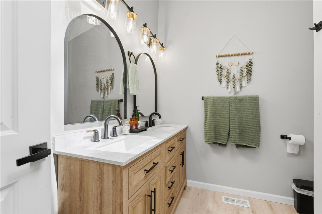 2950 Fairfield Pike Springfield, OH 45502 - Photo 30 of 48 This modern bathroom features a stylish vanity with double sinks, sleek fixtures, and ample storage.