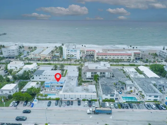 a group of cars parked in front of a building