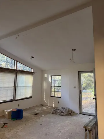 a room with gym equipment and a window