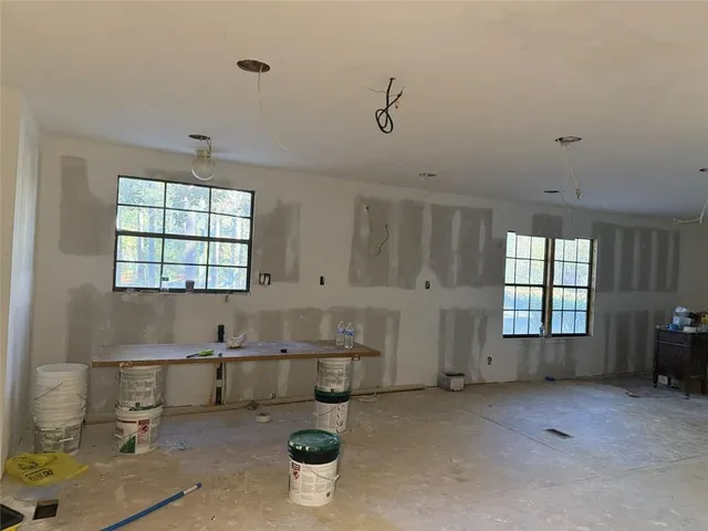 a view of a room with window and cabinet