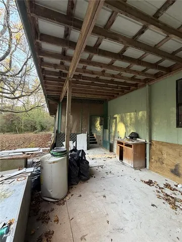 a view of a patio with a table and chairs