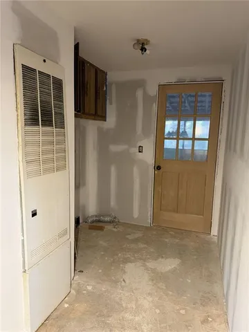 a view of an empty room with windows