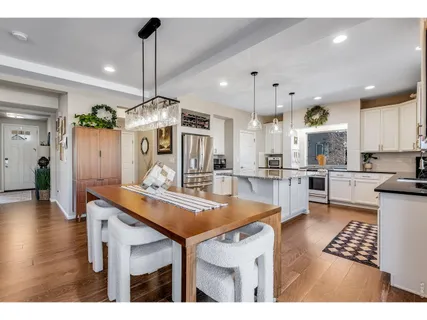 a kitchen with stainless steel appliances kitchen island a large island in the center