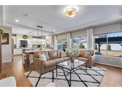 a living room with furniture and a table