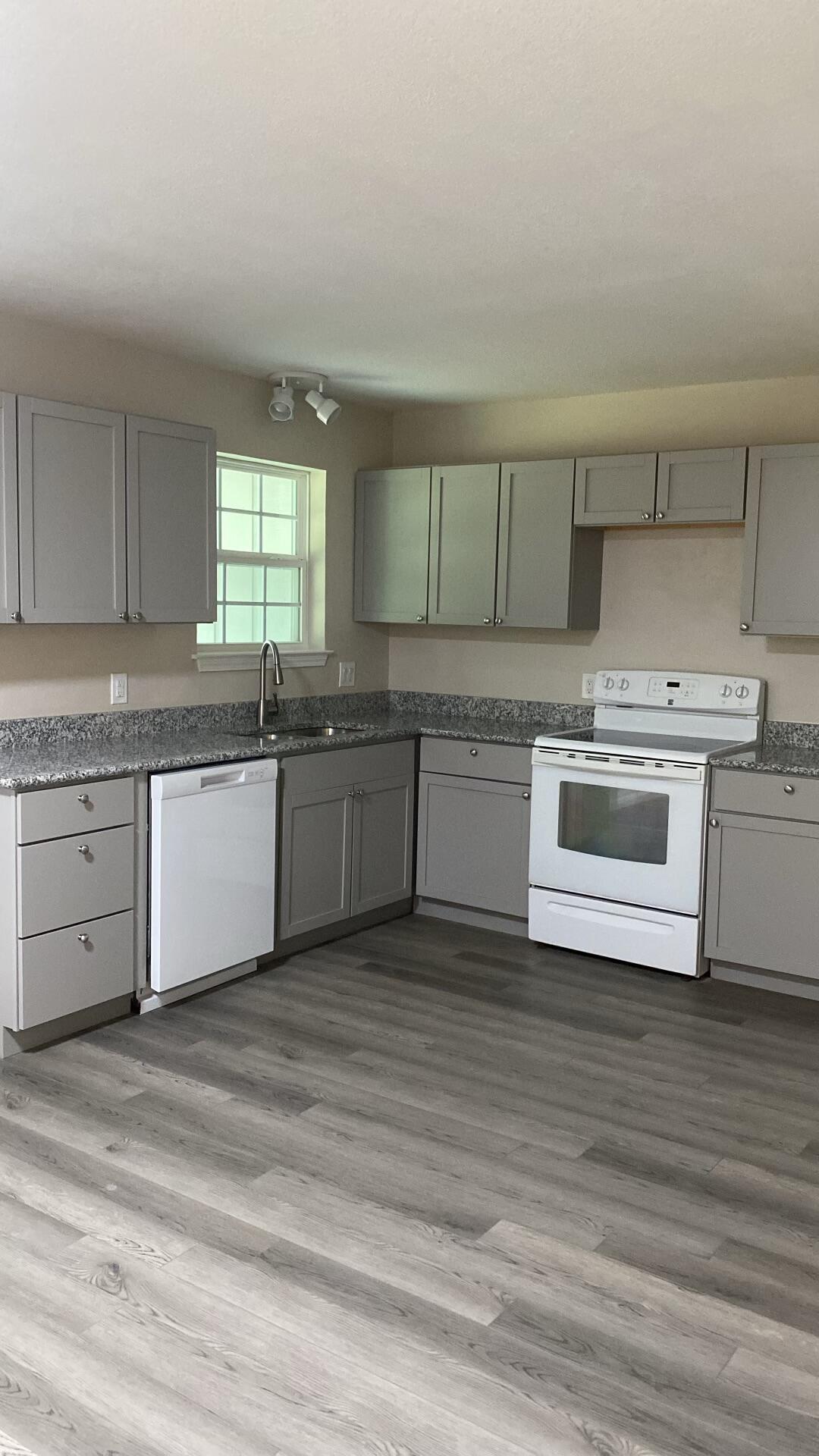 122 Hampton Drive Crestview, FL 32539 - Photo 5 of 6 a kitchen with stainless steel appliances granite countertop a sink and cabinets