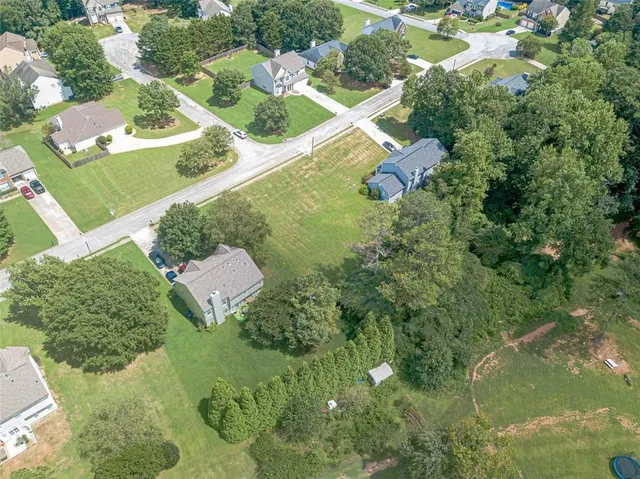 an aerial view of residential house with outdoor space and street view