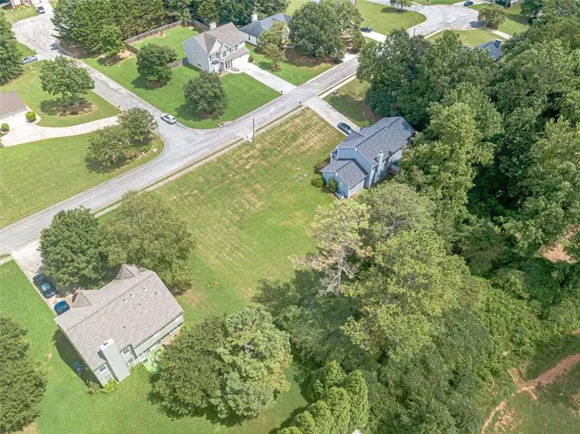 an aerial view of house with yard swimming pool and outdoor seating