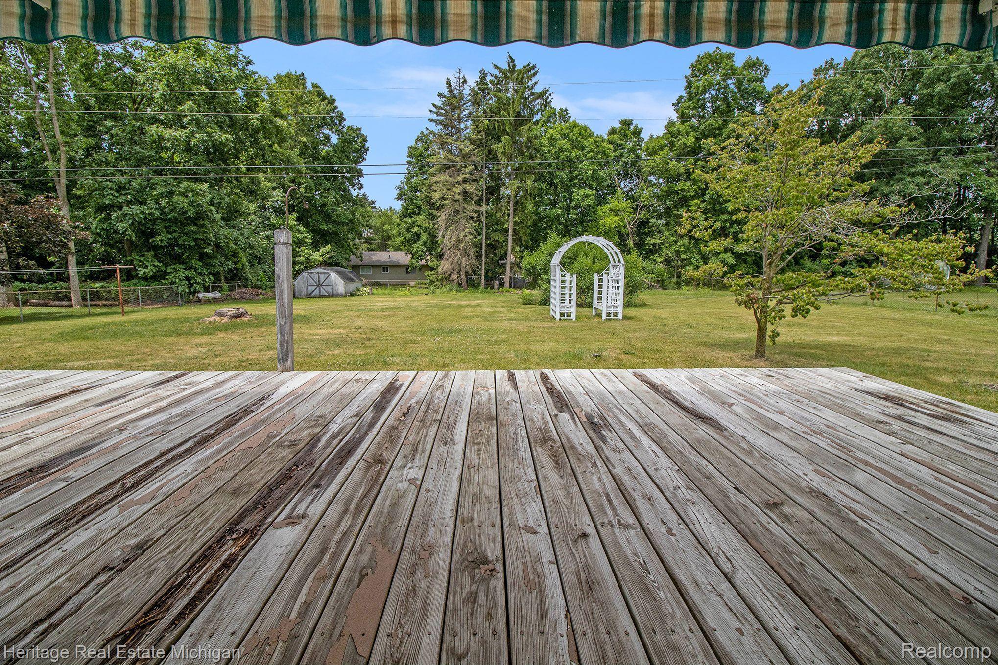 1267 Oakcrest Road Howell, MI 48843 - Photo 13 of 19 View from the deck- spacious fenced back yard