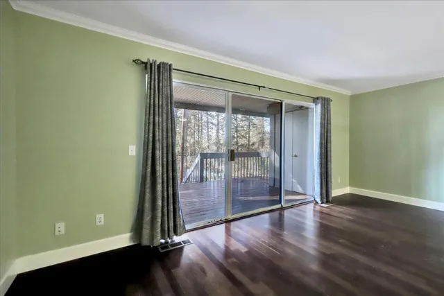 a view of a livingroom with wooden floor