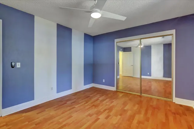 a view of balcony with wooden floor and fence