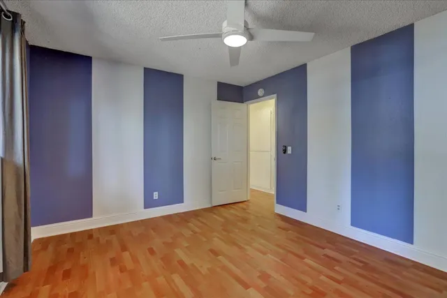 a view of a wooden balcony and trees