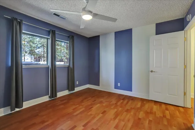 a view of balcony with wooden floor
