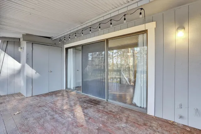 front view of a house with a tree in front of it