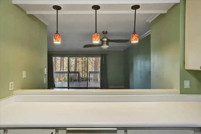a view of empty room with wooden floor and window