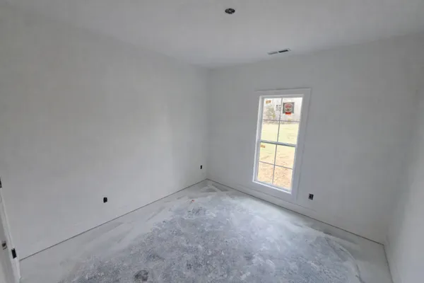 a view of empty room with windows