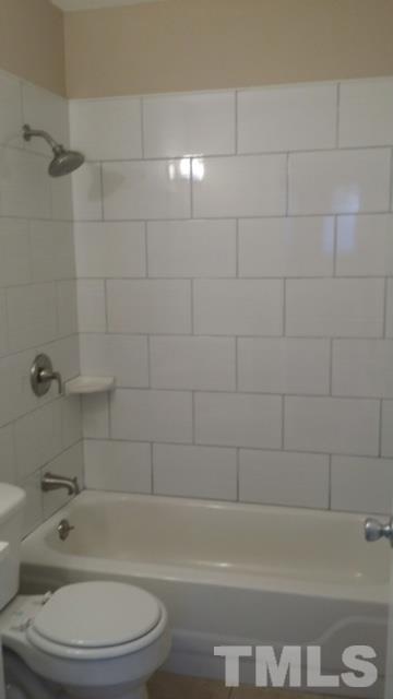 2604 Sanderford Road Raleigh, NC 27610 - Photo 13 of 22 a bathroom with a toilet and shower