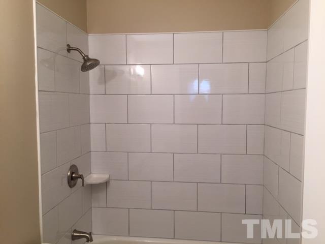 2604 Sanderford Road Raleigh, NC 27610 - Photo 16 of 22 a bathroom with a shower