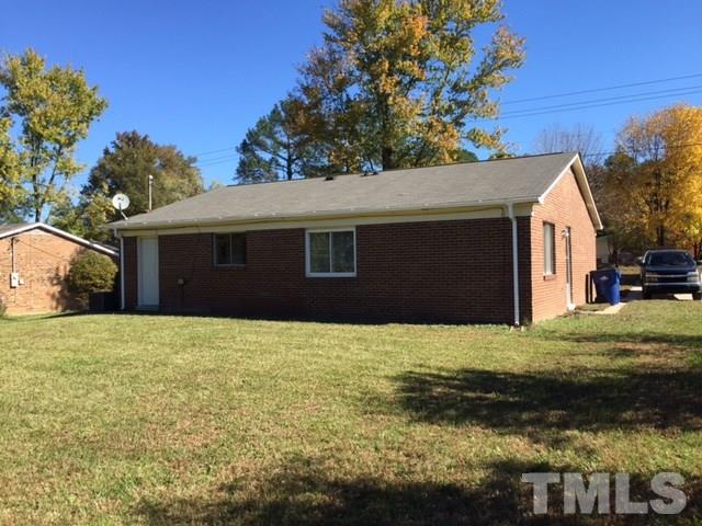 2604 Sanderford Road Raleigh, NC 27610 - Photo 3 of 22 a house that has a tree in front of it