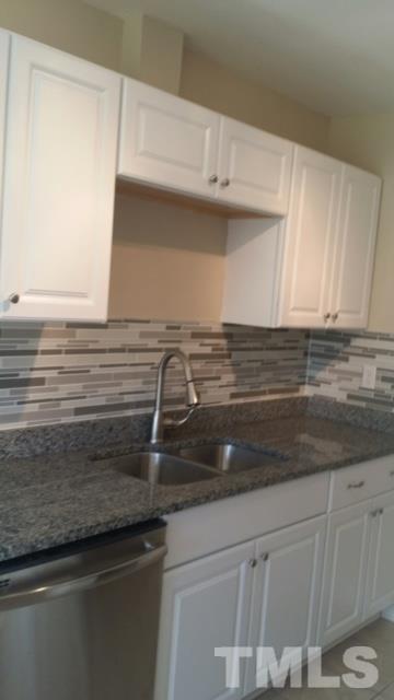 2604 Sanderford Road Raleigh, NC 27610 - Photo 8 of 22 a close view of sink and cabinets