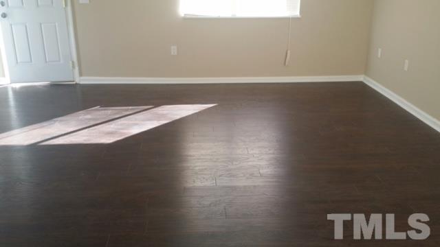 2604 Sanderford Road Raleigh, NC 27610 - Photo 10 of 22 a view of wooden floor and cabinets in a room