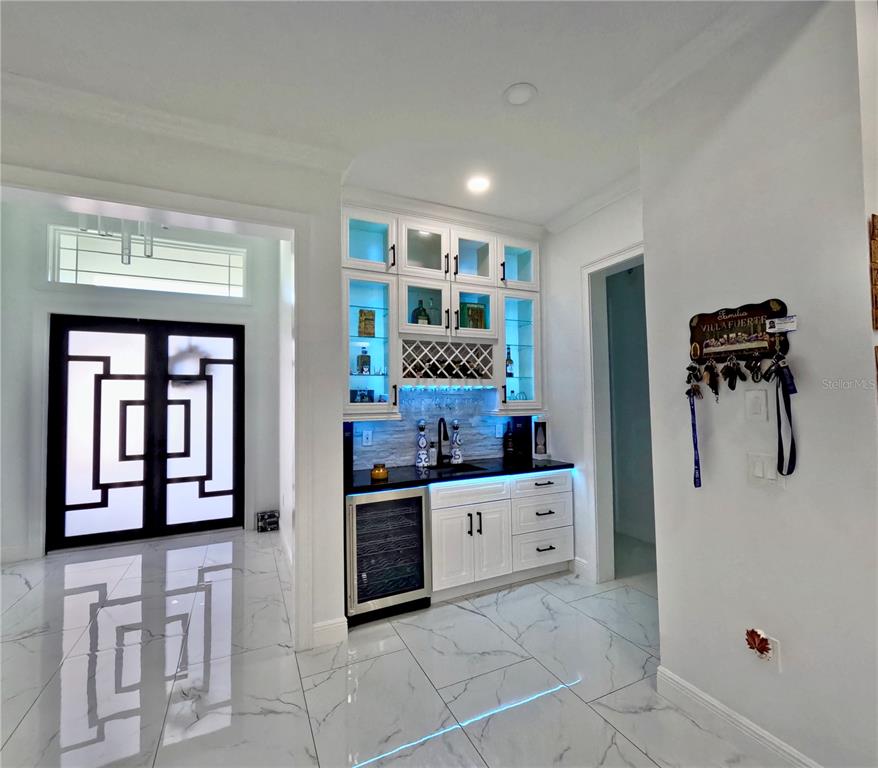 10112 Judy Road Dover, FL 33527 - Photo 12 of 50 a kitchen with granite countertop a refrigerator and a stove top oven