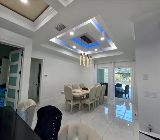 a view of a dining room with furniture and window