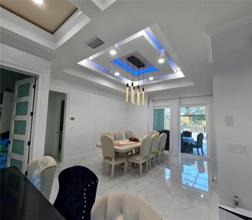 10112 Judy Road Dover, FL 33527 - Photo 14 of 50 a living room with furniture and a large window